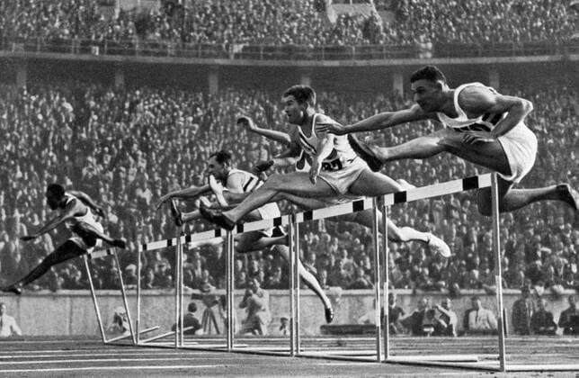 1936 Olympics, Berlin - Forrest Towns (2nd from right) runs in the intermediate run achieving a new world record with 14.1 seconds. Â  UnitedArchives00835241