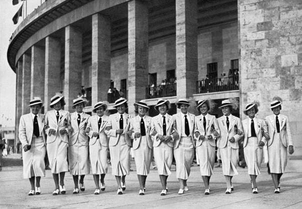 1936 Olympics, Berlin - The Olympics are a big experience for these young sportswomen of the world. This picture shows the Hungarian athletes, chipper, fresh and laughing, arm in arm outside the Olympic stadium. (Fur die jungen Sportlerinnen aller Lander waren die Olympischen Spiele ein grosses Erlebnis. Dieses Bild zeigt die ungarischen Leichtathletinnen Arm in Arm unter dem Saulengang des Olympiastadions; - frolich und frisch lachen sie in diese Welt.) Â  UnitedArchives00835420