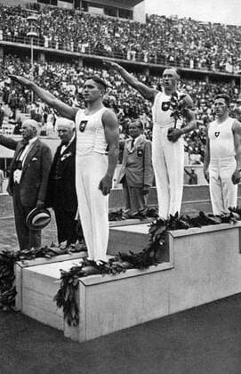 1936 Olympics, Berlin - Gymnastics men s vault winners: 1. Karl-Alfred Schwarzmann (Germany - centre), 2. Eugen Mack (Switzerland - right), Matthias Volz (Germany - left). Â  UnitedArchives00927252