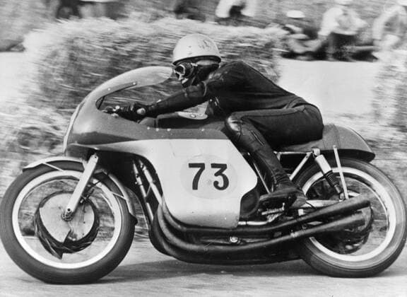 Imola, Italy: Rhodesian Motor-cycling ace, Gary Hocking, on a M.V. is seen in action during the 500 C>C> event of the 8th Shell Trophy, The Golden Cup, at Imola, April 16th. He covered the 30 laps (150,510 kilometres) in 1 hour 2 min. 49.7 seconds at an average speed of 143.735 kilometres per hour to win the event. In second place was Britain s Dale on a Norton. 19 April 1961  UnitedArchives00933798