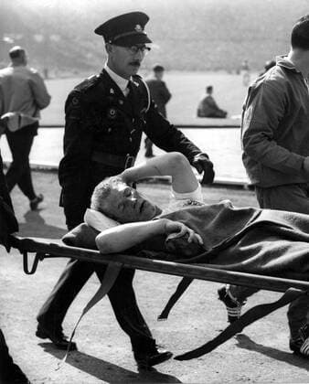 6th May 1959: England versus Italy at Wembley. Photo shows: Ron Flowers (Wolverhampton Wanderers), the England left-half, leaves the field on a stretcher after being injured in the match.  UnitedArchives01009434
