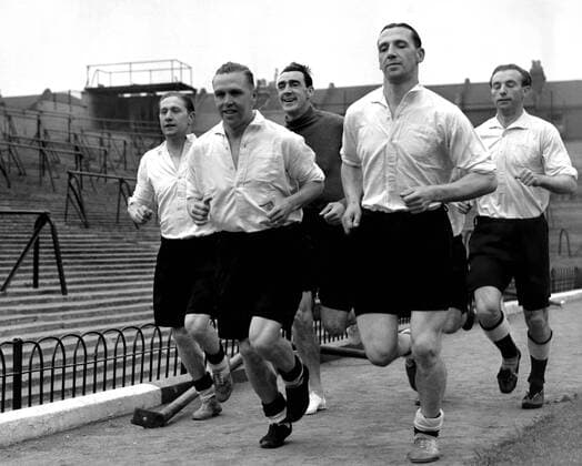 10th May 1948: England football players loosen up at Highbury in preparation for their match versus Italy. (l-r) Stanley Mortenson (Blackpool), Scott (Arsenal), Swift (Manchester City), Lawton (Notts County) and Stanley Matthews (Blackpool).  UnitedArchives01009648