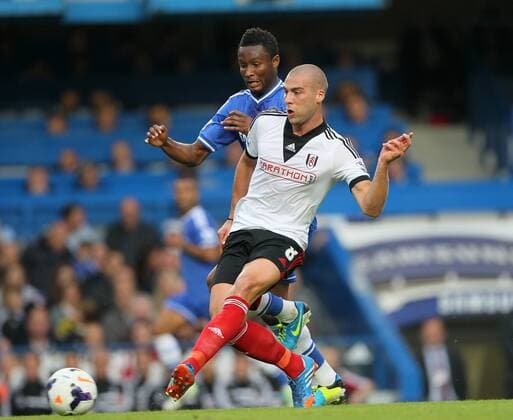 Chelsea s Mikel tussles with Fulham s Pajtim Kasami Chelsea FC London v FC Fulham - Barclays Premier League- Stamford Bridge - London - England -21 09 2013 - EDITORIAL USE ONLY. No use with unauthorised audio, video, data, fixture lists, club league logos or live services. Online in-match use limited to 120 images, no video emulation. No use in betting, games or single club league player publications.