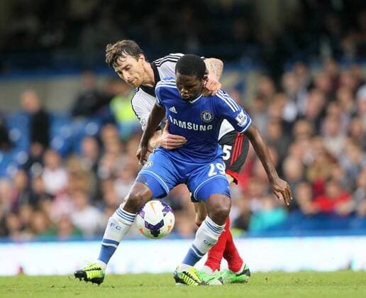 Chelsea s Samuel Eto o tussles with Fulham s Fernando Amorebieta Chelsea FC London v FC Fulham - Barclays Premier League- Stamford Bridge - London - England -21 09 2013 - EDITORIAL USE ONLY. No use with unauthorised audio, video, data, fixture lists, club league logos or live services. Online in-match use limited to 120 images, no video emulation. No use in betting, games or single club league player publications.