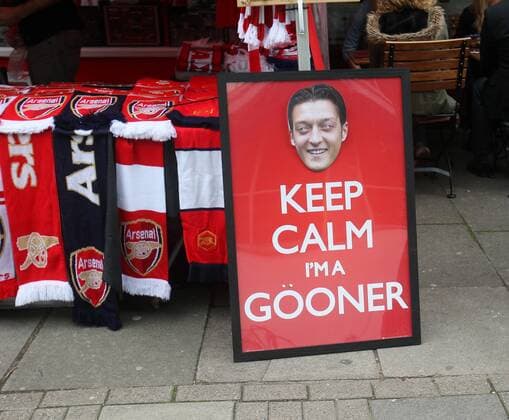 An Mesut Özil face mask on a stall outside the ground Arsenal FC London - Barclays Premier League- Emirates Stadium - London - England -22 09 2013 - EDITORIAL USE ONLY. No use with unauthorised audio, video, data, fixture lists, club league logos or live services. Online in-match use limited to 120 images, no video emulation. No use in betting, games or single club league player publications.
