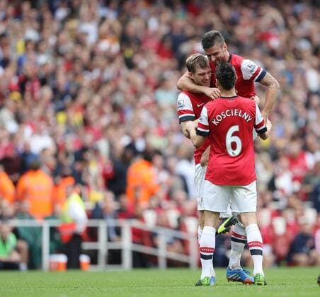 Arsenal s Per Mertesacker celebrates scoring his sides second goal Arsenal v Stoke - Barclays Premier League- Emirates Stadium - London - England -22 09 2013 - EDITORIAL USE ONLY. No use with unauthorised audio, video, data, fixture lists, club league logos or live services. Online in-match use limited to 120 images, no video emulation. No use in betting, games or single club league player publications.
