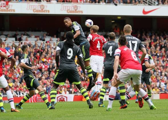 Arsenal s Per Mertesacker scoring his sides second goal Arsenal v Stoke - Barclays Premier League- Emirates Stadium - London - England -22 09 2013 - EDITORIAL USE ONLY. No use with unauthorised audio, video, data, fixture lists, club league logos or live services. Online in-match use limited to 120 images, no video emulation. No use in betting, games or single club league player publications.