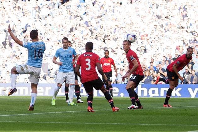 Sergio Kun Aguero of Manchester City scores the opening goal - Manchester City vs Manchester United - Barclay s Premier League - Etihad Stadium - Manchester - 22 09 2013 EDITORIAL USE ONLY. No use with unauthorised audio, video, data, fixture lists, club league logos or live services. Online in-match use limited to 120 images, no video emulation. No use in betting, games or single club league player publications.