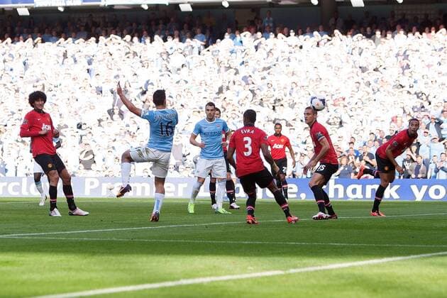 Sergio Kun Aguero of Manchester City scores the opening goal - Manchester City vs Manchester United - Barclay s Premier League - Etihad Stadium - Manchester - 22 09 2013 EDITORIAL USE ONLY. No use with unauthorised audio, video, data, fixture lists, club league logos or live services. Online in-match use limited to 120 images, no video emulation. No use in betting, games or single club league player publications.