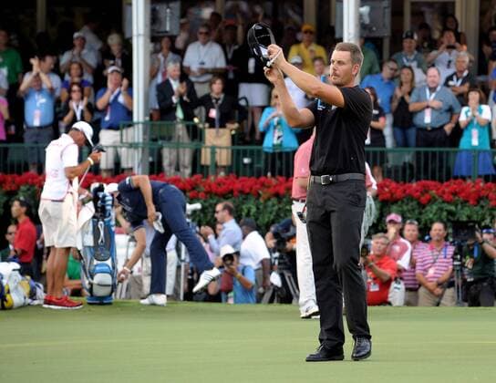 Tournament winner Henrik Stenson applauds the gallery from No. 18 after putting out during the final round of the PGA Golf Herren Tour Championship on September 22, 2013 at East Lake Golf Club in Atlanta. Stenson also won the FedEx Cup playoff with a 13-under par score for a $10 million payout bonus.  AJP2013092216