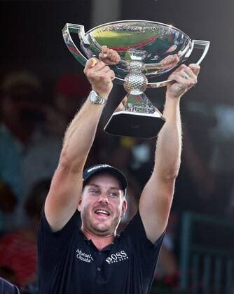 Sept. 22, 2013 - Atlanta, GA, USA - Henrik Stenson hoists the FedEx Cup trophy winning about 11.4 million in money and prizes after winning the Tour Championship with a total of 13-under par at East Lake Golf Club on Sunday, September 22, 2013, in Atlanta, Georgia. Tour Championship - ZUMAm67