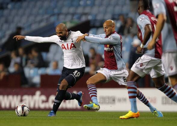 Sandro of Tottenham Hotspur competes with Karim El Ahmadi - Football - Capital One Cup - Aston Villa vs Tottenham Hotspur - Villa Park Birmingham - Season 2013-2014 - September 24th 2013 - Photograph Malcolm Couzens Sportimage EDITORIAL USE ONLY. No use with unauthorised audio, video, data, fixture lists, club league logos or live services. Online in-match use limited to 120 images, no video emulation. No use in betting, games or single club league player publications.