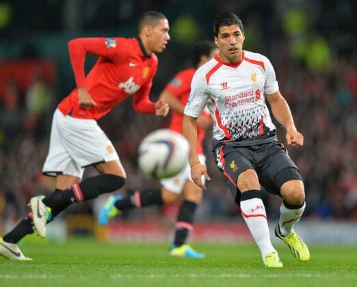Luis Suarez of Liverpool FC starts the game- Capital One Cup - Third Round - Manchester United (ManU) vs FC Liverpool - Old Trafford Stadium - Manchester - 25 09 13 - Picture Simon Bellis Sportimage EDITORIAL USE ONLY. No use with unauthorised audio, video, data, fixture lists, club league logos or live services. Online in-match use limited to 120 images, no video emulation. No use in betting, games or single club league player publications.
