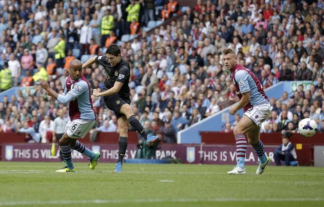Samir Nasri of Manchester City gets between Fabian Delph and Nathan Baker to shoot narrowly wide of goal - Football - Barclays Premier League - Aston Villa vs Manchester City - Villa Park Birmingham - Season 2013-2014 - September 28th 2013 - Photograph Malcolm Couzens Sportimage EDITORIAL USE ONLY. No use with unauthorised audio, video, data, fixture lists, club league logos or live services. Online in-match use limited to 120 images, no video emulation. No use in betting, games or single club league player publications.