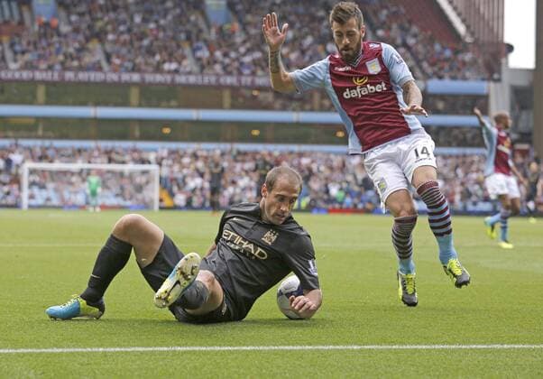 Pablo Zabaleta of Manchester City falls in the penalty area with Antonio Luna of Aston Vila close-by but fails to win a penalty - Football - Barclays Premier League - Aston Villa vs Manchester City - Villa Park Birmingham - Season 2013-2014 - September 28th 2013 - Photograph Malcolm Couzens Sportimage EDITORIAL USE ONLY. No use with unauthorised audio, video, data, fixture lists, club league logos or live services. Online in-match use limited to 120 images, no video emulation. No use in betting, games or single club league player publications.
