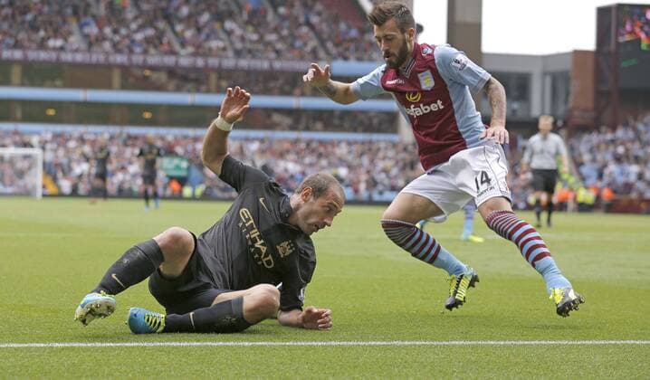 Pablo Zabaleta of Manchester City falls in the penalty area with Antonio Luna of Aston Vila close-by but fails to win a penalty - Football - Barclays Premier League - Aston Villa vs Manchester City - Villa Park Birmingham - Season 2013-2014 - September 28th 2013 - Photograph Malcolm Couzens Sportimage EDITORIAL USE ONLY. No use with unauthorised audio, video, data, fixture lists, club league logos or live services. Online in-match use limited to 120 images, no video emulation. No use in betting, games or single club league player publications.