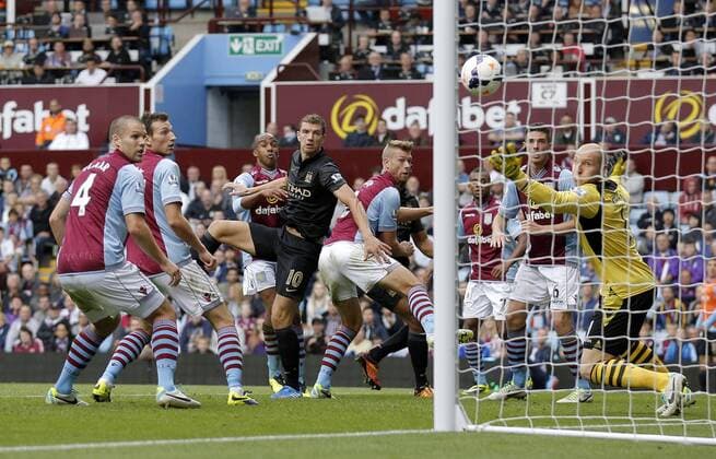 Edin Dzeko heads Manchester City into the lead at 2-1 - Football - Barclays Premier League - Aston Villa vs Manchester City - Villa Park Birmingham - Season 2013-2014 - September 28th 2013 - Photograph Malcolm Couzens Sportimage EDITORIAL USE ONLY. No use with unauthorised audio, video, data, fixture lists, club league logos or live services. Online in-match use limited to 120 images, no video emulation. No use in betting, games or single club league player publications.