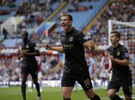 Edin Dzeko celebrates scoring to give Manchester City the lead at 2-1 - Football - Barclays Premier League - Aston Villa vs Manchester City - Villa Park Birmingham - Season 2013-2014 - September 28th 2013 - Photograph Malcolm Couzens Sportimage EDITORIAL USE ONLY. No use with unauthorised audio, video, data, fixture lists, club league logos or live services. Online in-match use limited to 120 images, no video emulation. No use in betting, games or single club league player publications.