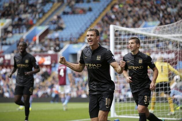 Edin Dzeko celebrates scoring to give Manchester City the lead at 2-1 - Football - Barclays Premier League - Aston Villa vs Manchester City - Villa Park Birmingham - Season 2013-2014 - September 28th 2013 - Photograph Malcolm Couzens Sportimage EDITORIAL USE ONLY. No use with unauthorised audio, video, data, fixture lists, club league logos or live services. Online in-match use limited to 120 images, no video emulation. No use in betting, games or single club league player publications.