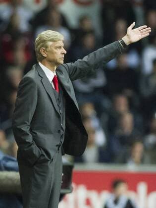 Football - 2013 2014 Premier League - Swansea City vs. Arsenal arsene wenger on the touchline at the Liberty Stadium. COLORSPORT WINSTON BYNORTH 