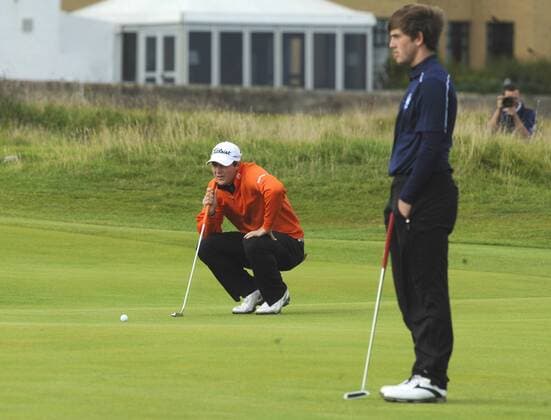 29.09.2013. St Andrews Scotland. The 4th and final Round of the Dunhill Golf Championship, from Old Course St Andrews Peter Uhlein lines up his putt on the 1st watched by Bradley Neil xLorrainexHillx  ActionPlus20517118