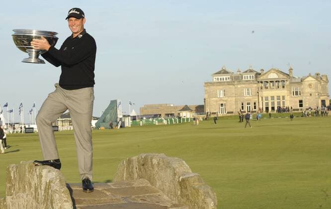29.09.2013. St Andrews Scotland. The 4th and final Round of the Dunhill Golf Championship, from Old Course St Andrews. David Howell on Swilken Bridge with his winners trophy xLorrainexHillx  ActionPlus20522695