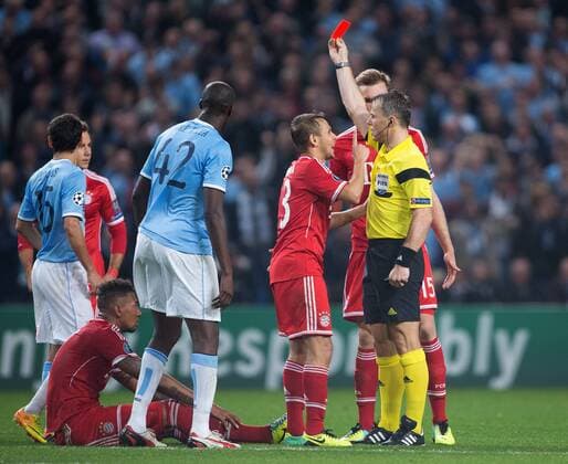 Referee Bjorn Kuipers shows Jerome Boateng of Munich a red card - Manchester City vs. FC Bayern Munich - UEFA Champion s League - Etihad Stadium - Manchester - 02 19 2013 Pic Philip Oldham Sportimage EDITORIAL USE ONLY. No use with unauthorised audio, video, data, fixture lists, club league logos or live services. Online in-match use limited to 120 images, no video emulation. No use in betting, games or single club league player publications.