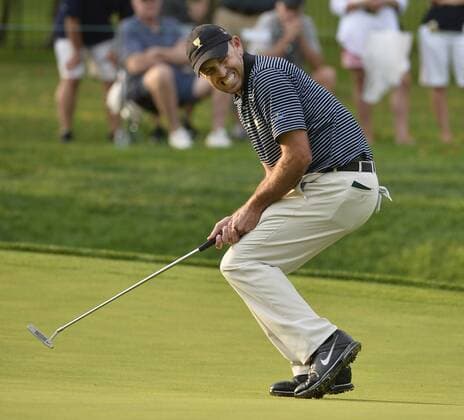 International Team member Charl Schwartzel of South Africa reacts after just missing an eagle putt on the seventh hole during the second round foursome competition against the United States Team at the 2013 Presidents Cup at Muirfield Village Golf Club in Dublin, Ohio on October 4, 2013.  BKX2013100450