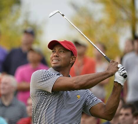 United States Team member Tiger Woods tees off on the eighth hole during the second round foursome competition against the International Team at the 2013 Presidents Cup at Muirfield Village Golf Club in Dublin, Ohio on October 4, 2013.  BKX2013100452