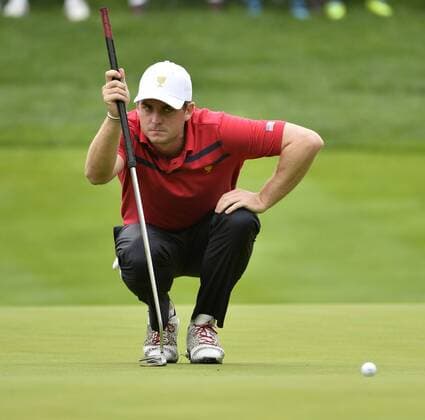 United States Team member Keegan Bradley lines up his putt on the fifth hole during the third round four-ball competition against the International Team at the 2013 Presidents Cup at Muirfield Village Golf Club in Dublin, Ohio on October 5, 2013.  BKX2013100507