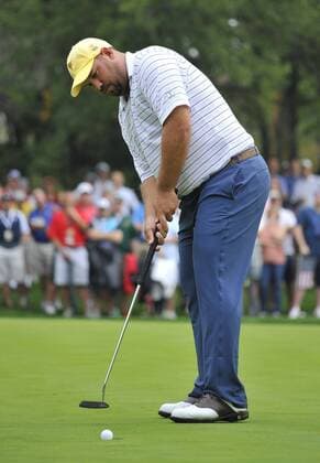 International Team member Brendon de Jonge of Zimbabwe sinks his birdie putt on the sixth hole during the third round four-ball competition against the United States Team at the 2013 Presidents Cup at Muirfield Village Golf Club in Dublin, Ohio on October 5, 2013.  BKX2013100520