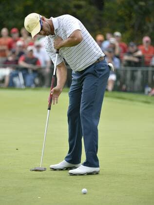 International Team member Adam Scott of Australia attempts a birdie putt on the seventh hole during the third round four-ball competition against the United States Team at the 2013 Presidents Cup at Muirfield Village Golf Club in Dublin, Ohio on October 5, 2013.  BKX2013100540