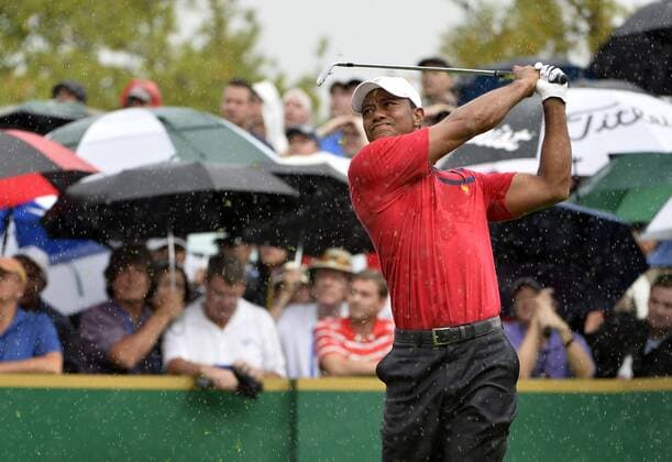 United States Team member Tiger Woods tees off on the eighth hole during the third round four-ball competition against the International Team at the 2013 Presidents Cup at Muirfield Village Golf Club in Dublin, Ohio on October 5, 2013.  BKX2013100543