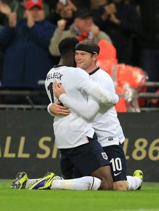 Wayne Rooney(R) and Daniel Welbedk of England celebrate scoring during the FIFA 2014 World Cup Qualifying match between England and Montenegro at Wembley Stadium in London, Britain on Oct. 11, 2013. England won 4-1.(Xinhua Yin Gang) (SP)BRITAIN-LONDON-SOCCER-FIFA 2014 WORLD CUP QUALIFIER-ENGLAND VS MONTENEGRO 