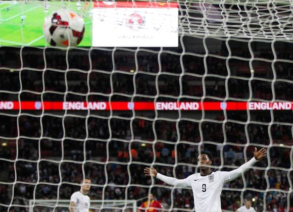 Daniel Sturridge of England celebrates scoring during the FIFA 2014 World Cup Qualifying match between England and Montenegro at Wembley Stadium in London, Britain on Oct. 11, 2013. England won 4-1.(Xinhua Yin Gang) (SP)BRITAIN-LONDON-SOCCER-FIFA 2014 WORLD CUP QUALIFIER-ENGLAND VS MONTENEGRO 