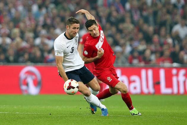 England s Gary Cahill and Poland s Robert Lewandowski - England v Poland - 2014 Fifa World Cup Qualifier - London - Wembley - England - 15 10 2013 - Pic Charlie Forgham-Bailey Sportimage EDITORIAL USE ONLY. No use with unauthorised audio, video, data, fixture lists, club league logos or live services. Online in-match use limited to 120 images, no video emulation. No use in betting, games or single club league player publications.