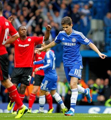 Football - 2013 2014 Premier League - Chelsea FC London vs Cardiff City Oscar of Chelsea celebrates scoring at Stamford Bridge Colorsport ShaunBoggust 