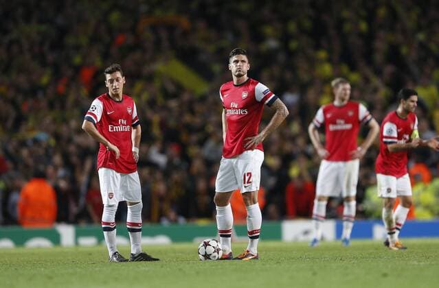Arsenal s Mesut Ozil and Olivier Giroud look on dejected after going 2-1 down Arsenal v Dortmund - UEFA Champions League - the Emirates - London - England -22 10 2013 - Pic David Klein Sportimage EDITORIAL USE ONLY. No use with unauthorised audio, video, data, fixture lists, club league logos or live services. Online in-match use limited to 120 images, no video emulation. No use in betting, games or single club league player publications.