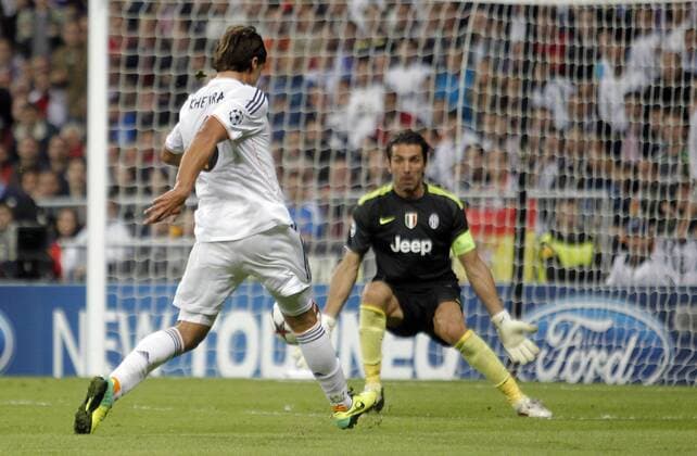 Soccer match between Real Madrid and Juventus Turin of the Champions League, held at the Santiago Bernabeu stadium, in Madrid 10 23 2013. Sami Khedira and Gianluigi Buffon 