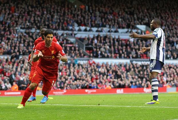 Liverpool s Luis Suarez celebrates scoring his third goal - Liverpool FC v West Bromwich Albion - Barclays Premier League - Anfield - Liverpool - England -26 10 2013 - EDITORIAL USE ONLY. No use with unauthorised audio, video, data, fixture lists, club league logos or live services. Online in-match use limited to 120 images, no video emulation. No use in betting, games or single club league player publications.