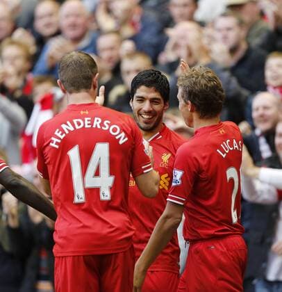 Liverpool s Luis Suarez celebrates scoring his third goal - Liverpool FC v West Bromwich Albion - Barclays Premier League - Anfield - Liverpool - England -26 10 2013 - EDITORIAL USE ONLY. No use with unauthorised audio, video, data, fixture lists, club league logos or live services. Online in-match use limited to 120 images, no video emulation. No use in betting, games or single club league player publications.