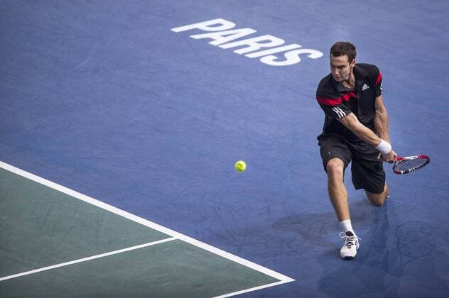PARIS, Oct. 2013 - Ernest Gulbis of Latvia returns the ball during the first day of the BNP Paribas 2013 Masters Tennis tournament in Paris, France, on Oct. 28, 2013. Verdasco won 2-0. (Xinhua Etienne Laurent) (SP)FRANCE-PARIS-ATP-MASTERS TENNIS 