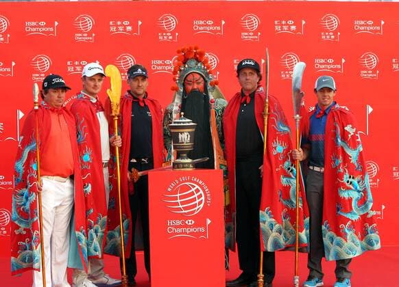 (131029) -- SHANGHAI , Oct. 29, 2013 (Xinhua) -- Golfers (From L-R) Jason Dufner of the United States, Justin Rose of England, defending Champion Ian Poulter of England, Phil Mickelson of the United States and Rory McIlroy of Northern Ireland, wearing Chinese costumes attend the photo call for the WGC-HSBC Champions tournament in Shanghai on October 29, 2013. (Xinhua Ren Long) (SP)CHINA-SHANGHAI-GOLF-WGC-HSBC CHAMPIOMSHIP 