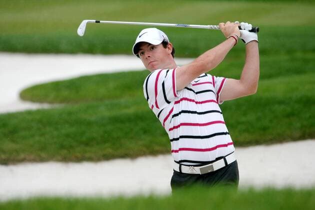 Rory McIlroy of Northern Ireland hits out of a bunker during the first round of the HSBC Champions golf tournament at the Sheshan International Golf Club in Shanghai, China, 31 October 2013. After struggling all year since changing clubs to Nike, former world number one Rory McIlroy left a field containing 40 of the worlds top 50 in his wake as he shot a seven-under par round of 65 to lead the WGC-HSBC Champions in Shanghai by two shots Thursday (31 October 2013). But he cautioned against getting carried away by a performance at which he outshone in-form playing partner and recent US PGA Golf Herren Champion Jason Dufner by eight shots. McIlroy fired seven birdies in his first 11 holes, and eight in all. He had just one bogey at the tough par-four 11th, his second hole. More importantly he looked like the McIlroy of a year ago who won the money lists on both sides of the Atlantic and  20131031_60543