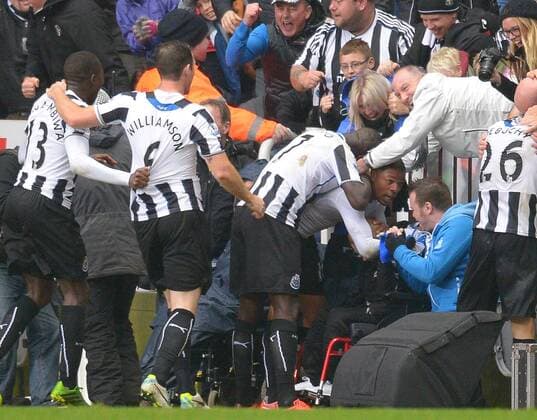 Loic Remy of Newcastle United celebrates with the fans following the second goal - Barclays Premier League - Newcastle Utd vs Chelsea - St James Park Stadium - Newcastle - England - 02 11 13 - Picture Simon Bellis Sportimage EDITORIAL USE ONLY. No use with unauthorised audio, video, data, fixture lists, club league logos or live services. Online in-match use limited to 120 images, no video emulation. No use in betting, games or single club league player publications.