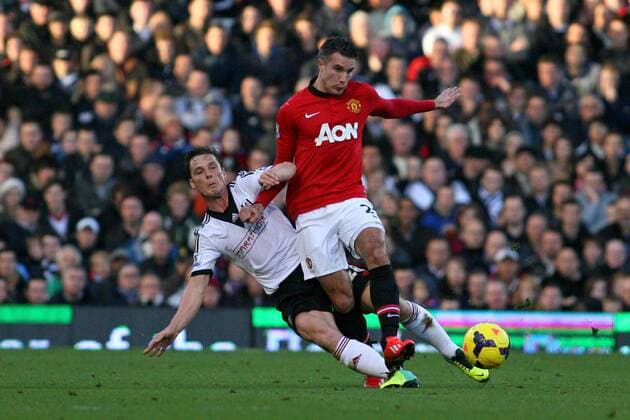 Football - 2013 2014 Premier League - Fulham vs. Manchester United Fulhams Scott Parker tackles Robin Van Persie of Manchester United at Craven Cottage Colorsport Shaun Boggust 