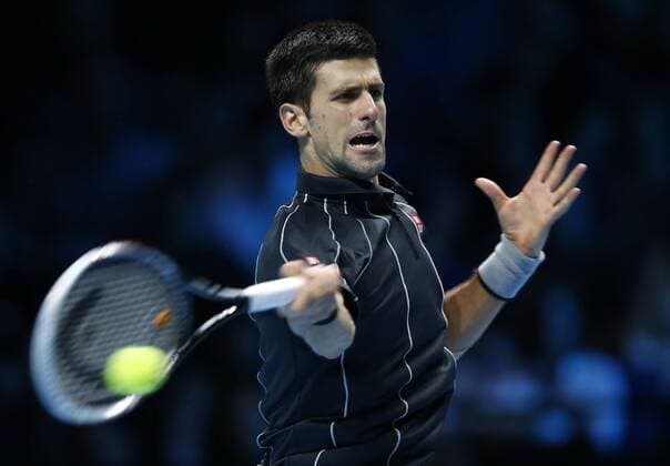 Novak Djokovic of Serbia returns the ball during the Singles Group B match on day 4 of the Barclays ATP Tennis Herren World Tour Finals at the O2 Arena in London, Britain, Nov. 7, 2013. Novak Djokovic won 2-1. (Xinhua Wang Lili) (SP)BRITAIN-LONDON-TENNIS-ATP FINALS-SINGLES-GROUP B- 