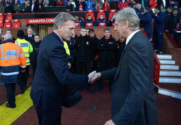David Moyes manager of Manchester United greets Arsene Wenger manager of Arsenal - Barclays Premier League - Manchester United (ManU) vs Arsenal FC London - Old Trafford Stadium - Manchester - England - 10 11 13 - EDITORIAL USE ONLY. No use with unauthorised audio, video, data, fixture lists, club league logos or live services. Online in-match use limited to 120 images, no video emulation. No use in betting, games or single club league player publications.