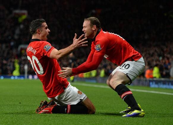 Robin van Persie of Manchester United celebrates his goal with Wayne Rooney of Manchester United - Barclays Premier League - Manchester United (ManU) vs Arsenal FC London - Old Trafford Stadium - Manchester - England - 10 11 13 - EDITORIAL USE ONLY. No use with unauthorised audio, video, data, fixture lists, club league logos or live services. Online in-match use limited to 120 images, no video emulation. No use in betting, games or single club league player publications.