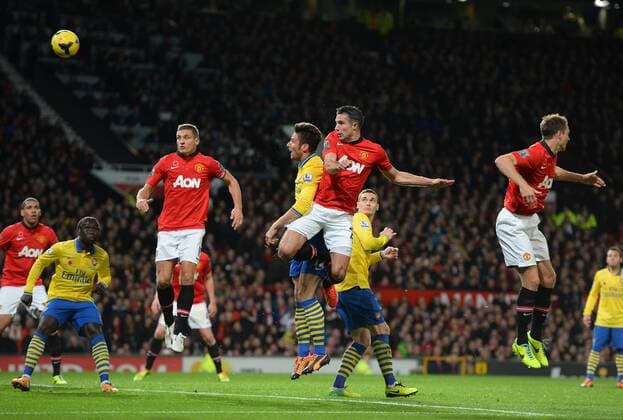 Robin van Persie of Manchester United scores the first goal - Barclays Premier League - Manchester United (ManU) vs Arsenal FC London - Old Trafford Stadium - Manchester - England - 10 11 13 - EDITORIAL USE ONLY. No use with unauthorised audio, video, data, fixture lists, club league logos or live services. Online in-match use limited to 120 images, no video emulation. No use in betting, games or single club league player publications.
